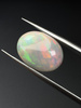 Opal ciemny naturalny kaboszon owal 14,07 x 11,11 mm