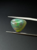 Opal ciemny naturalny kaboszon trylion 11,70 mm