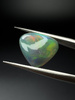 Opal ciemny naturalny kaboszon trylion 11,70 mm