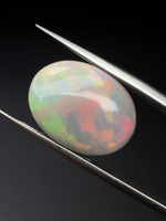 Opal ciemny naturalny kaboszon owal 14,07 x 11,11 mm