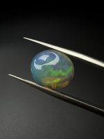 Opal ciemny naturalny kaboszon owal 13,15 x 11,48 mm